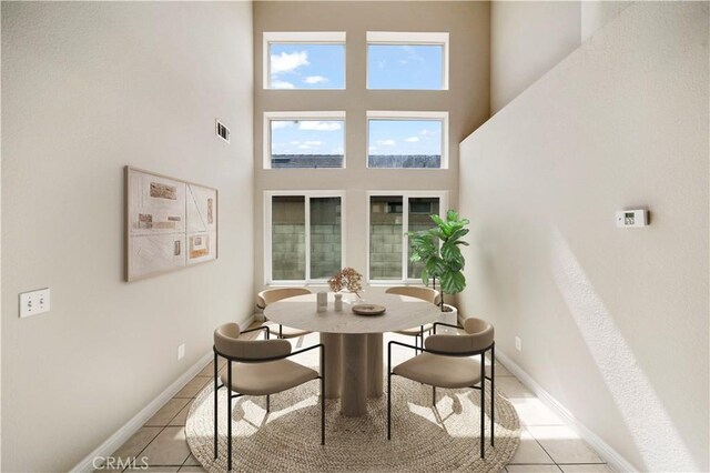 15965 Peach Tree Ln, Fontana, CA 92337 - dining area with a towering ceiling and light tile patterned floors