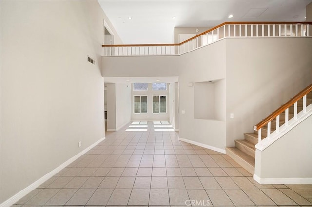 15965 Peach Tree Ln, Fontana, CA 92337 - stairs with tile patterned flooring, a towering ceiling, and recessed lighting