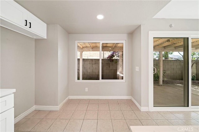 15965 Peach Tree Ln, Fontana, CA 92337 - unfurnished dining area featuring light tile patterned flooring and recessed lighting