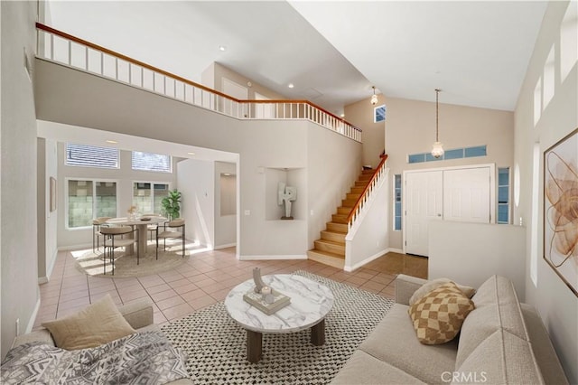 15965 Peach Tree Ln, Fontana, CA 92337 - tiled living area with high vaulted ceiling and stairway