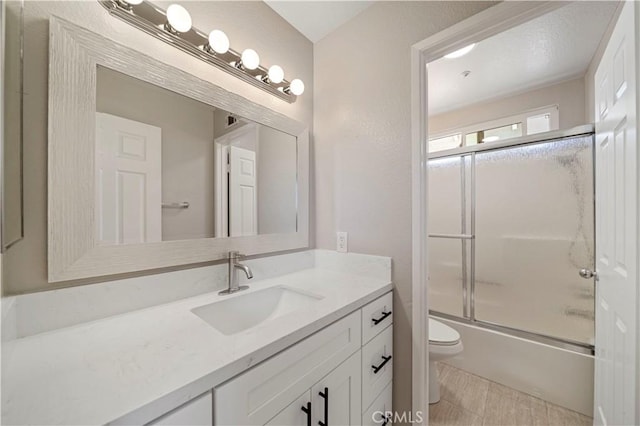 15965 Peach Tree Ln, Fontana, CA 92337 - bathroom featuring vanity and combined bath / shower with glass door
