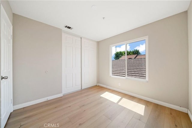 15965 Peach Tree Ln, Fontana, CA 92337 - unfurnished bedroom featuring light wood-type flooring and a closet