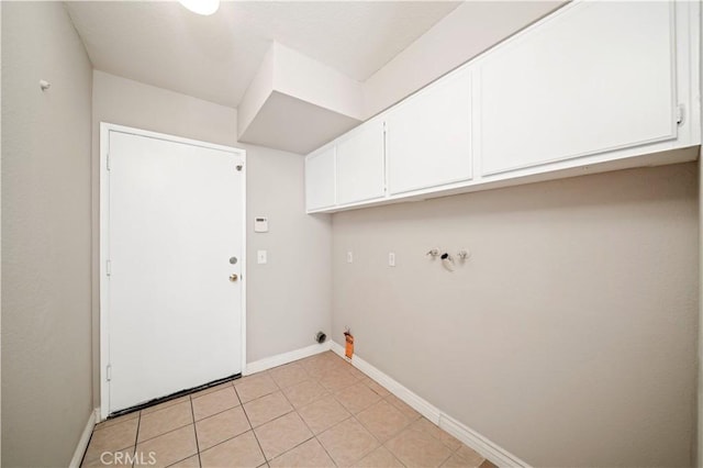 15965 Peach Tree Ln, Fontana, CA 92337 - washroom featuring cabinet space, hookup for a washing machine, gas dryer hookup, and light tile patterned flooring