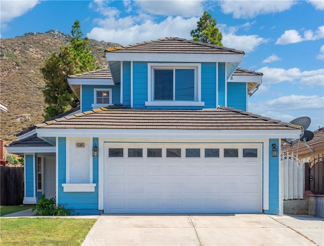 15965 Peach Tree Ln, Fontana, CA 92337 - view of front of house with concrete driveway, a garage, and a tiled roof