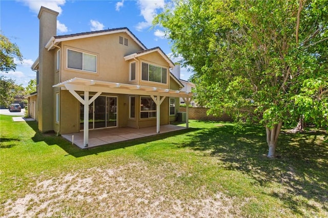 2311 Gillingham Cir, Thousand Oaks, CA 91362 - back of house with a chimney, stucco siding, and a patio
