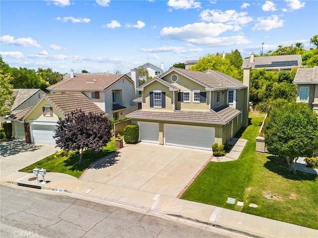 2311 Gillingham Cir, Thousand Oaks, CA 91362 - traditional-style home featuring a tile roof, a garage, driveway, a front yard, and a residential view