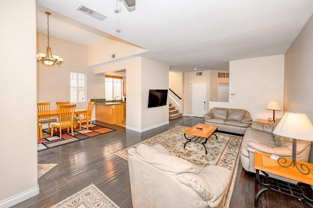 27625 Primrose Ln, Castaic, CA 91384 - living area with stairway, a chandelier, dark wood finished floors, and a ceiling fan
