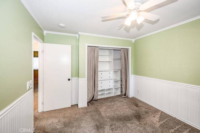 27625 Primrose Ln, Castaic, CA 91384 - unfurnished bedroom featuring wainscoting, ornamental molding, carpet flooring, a closet, and ceiling fan