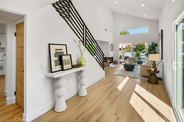 22627 Lakeside Ln, Lake Forest, CA 92630 - entryway with recessed lighting, wood finished floors, high vaulted ceiling, and stairs