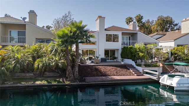 22627 Lakeside Ln, Lake Forest, CA 92630 - back of house with a balcony, stairs, stucco siding, and a patio area