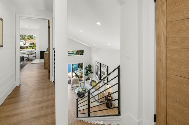 22627 Lakeside Ln, Lake Forest, CA 92630 - hallway with an upstairs landing, wood finished floors, lofted ceiling, and recessed lighting
