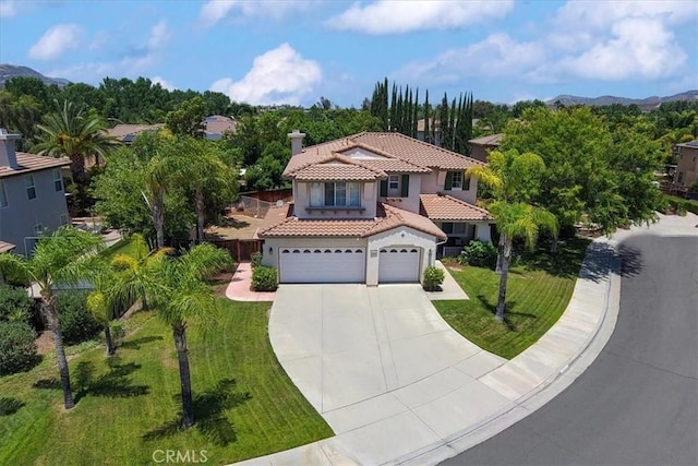 42365 Westar Ct, Murrieta, CA 92562 - mediterranean / spanish-style house with a tile roof, driveway, stucco siding, a front lawn, and an attached garage