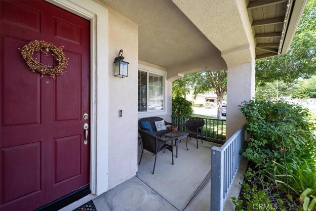 42365 Westar Ct, Murrieta, CA 92562 - property entrance featuring covered porch and stucco siding
