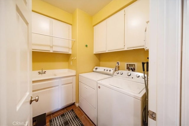 42365 Westar Ct, Murrieta, CA 92562 - laundry area featuring cabinet space, washing machine and dryer, and dark tile patterned floors