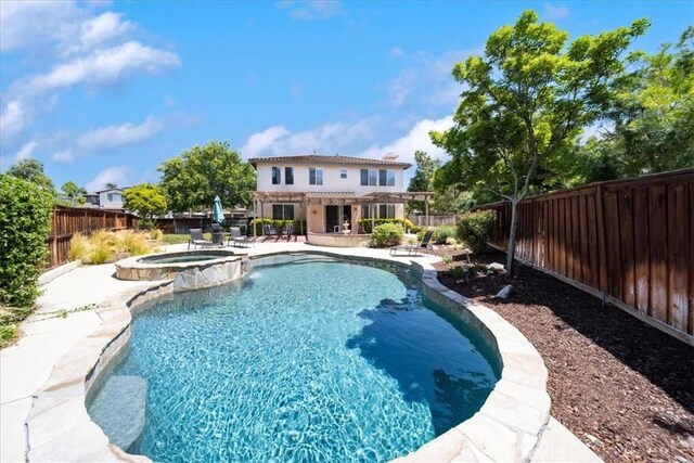 42365 Westar Ct, Murrieta, CA 92562 - view of swimming pool featuring a patio, a fenced backyard, and a pool with connected hot tub