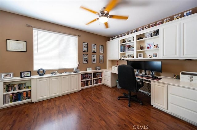42365 Westar Ct, Murrieta, CA 92562 - office featuring built in study area, a ceiling fan, and dark wood finished floors