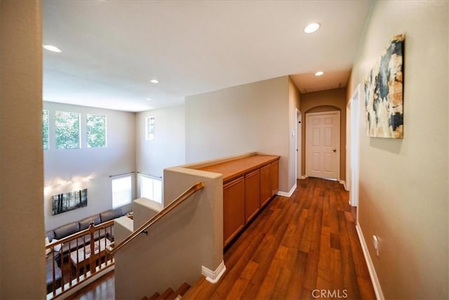 42365 Westar Ct, Murrieta, CA 92562 - corridor with an upstairs landing, recessed lighting, dark wood-style floors, and arched walkways