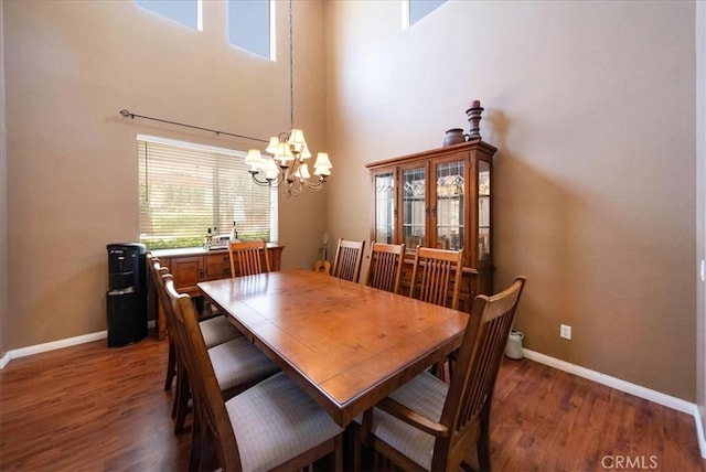 42365 Westar Ct, Murrieta, CA 92562 - dining space with a chandelier, wood finished floors, and a high ceiling