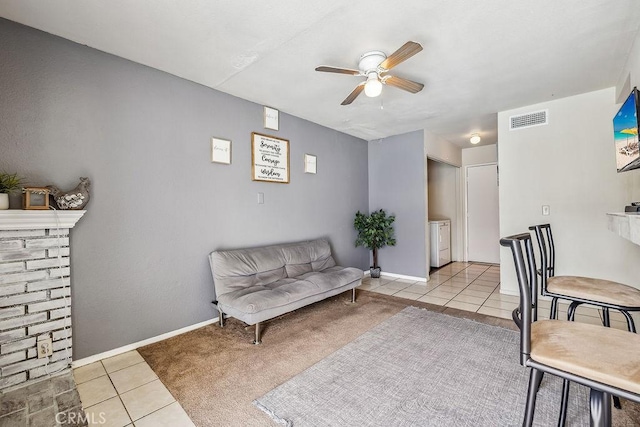 2134 Moonlight Ct, Palmdale, CA 93550 - living area with ceiling fan, washing machine and dryer, and tile patterned floors