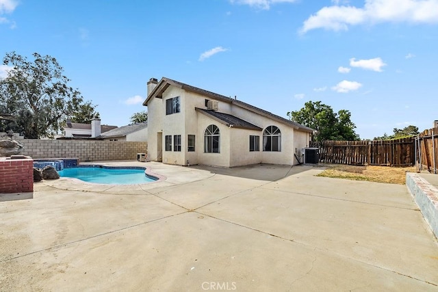 2134 Moonlight Ct, Palmdale, CA 93550 - rear view of property with stucco siding, a chimney, a patio, and a fenced backyard