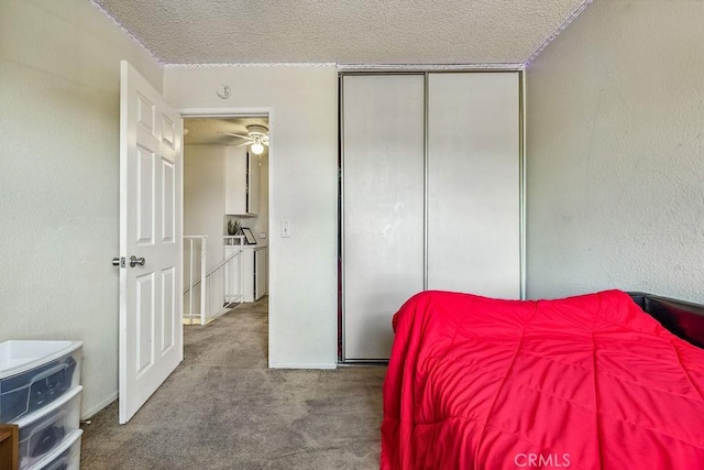 2134 Moonlight Ct, Palmdale, CA 93550 - carpeted bedroom with a textured ceiling and a closet