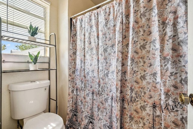 2134 Moonlight Ct, Palmdale, CA 93550 - bathroom featuring toilet and a shower with curtain