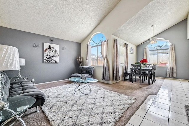 2134 Moonlight Ct, Palmdale, CA 93550 - living area featuring a textured ceiling, vaulted ceiling, light carpet, light tile patterned floors, and ceiling fan
