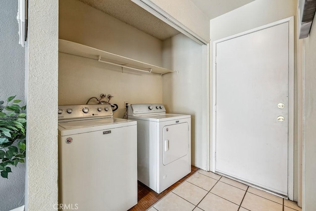 2134 Moonlight Ct, Palmdale, CA 93550 - laundry room featuring washer and clothes dryer and light tile patterned flooring