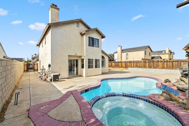 2134 Moonlight Ct, Palmdale, CA 93550 - view of swimming pool with a pool with connected hot tub, a fenced backyard, and a patio area
