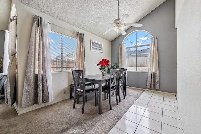2134 Moonlight Ct, Palmdale, CA 93550 - dining room with a textured ceiling, vaulted ceiling, a ceiling fan, and tile patterned floors