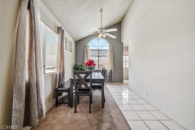 2134 Moonlight Ct, Palmdale, CA 93550 - dining area with ceiling fan, a textured ceiling, light tile patterned floors, vaulted ceiling, and a textured wall