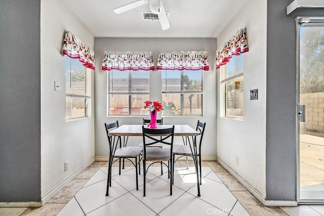 2134 Moonlight Ct, Palmdale, CA 93550 - dining area featuring healthy amount of natural light, ceiling fan, a textured wall, and tile patterned flooring