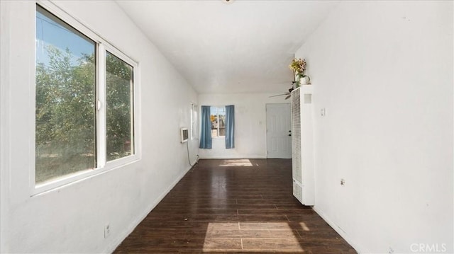 533 E Fredricks St, Barstow, CA 92311 - corridor with wood finished floors and a heating unit