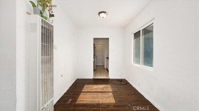 533 E Fredricks St, Barstow, CA 92311 - hallway featuring a heating unit and wood finished floors