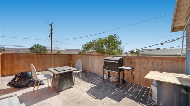533 E Fredricks St, Barstow, CA 92311 - view of patio with an outdoor fire pit and grilling area