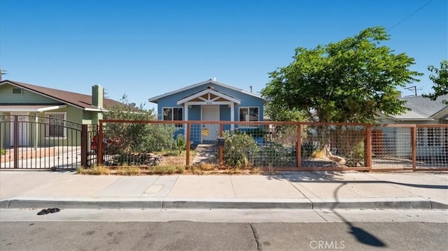533 E Fredricks St, Barstow, CA 92311 - view of front facade with a fenced front yard and a gate
