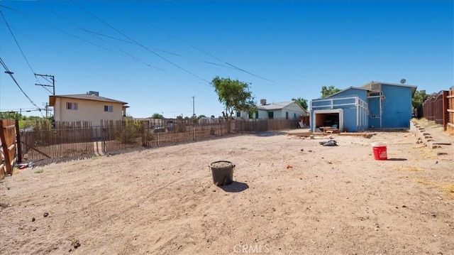 533 E Fredricks St, Barstow, CA 92311 - fenced backyard featuring an outbuilding