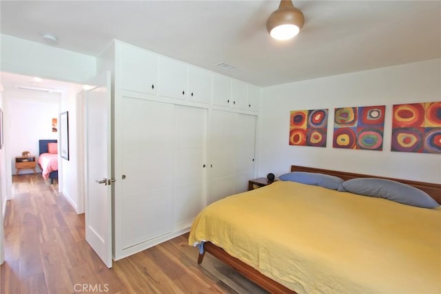170 Avenida Majorca Unit A, Laguna Woods, CA 92637 - bedroom featuring light wood finished floors and a closet