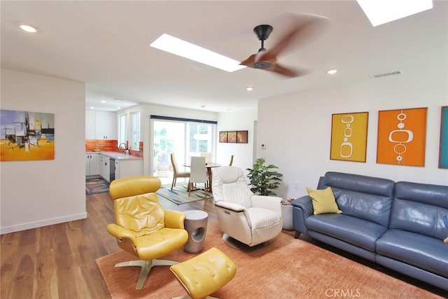 170 Avenida Majorca Unit A, Laguna Woods, CA 92637 - living area featuring a skylight, ceiling fan, wood finished floors, and recessed lighting