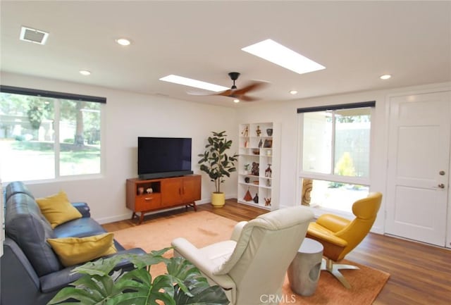170 Avenida Majorca Unit A, Laguna Woods, CA 92637 - living room featuring a skylight, plenty of natural light, wood finished floors, and recessed lighting
