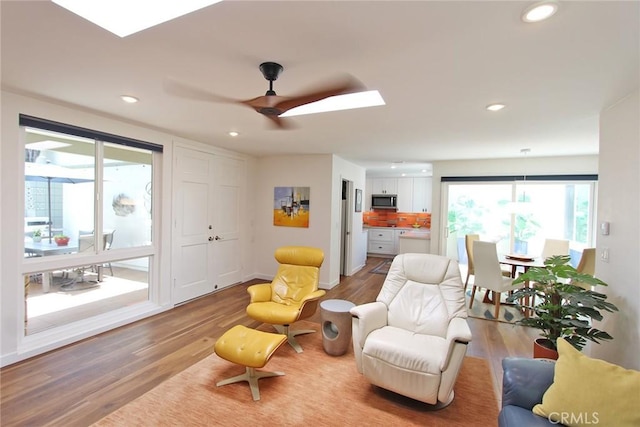 170 Avenida Majorca Unit A, Laguna Woods, CA 92637 - living room with wood finished floors, a skylight, ceiling fan, and recessed lighting