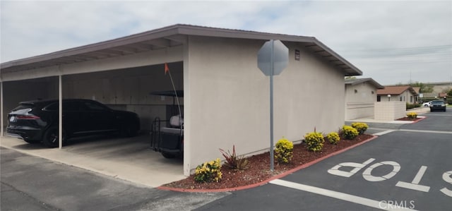 13141 Shawnee Ln Unit M-11 # 267-C, Seal Beach, CA 90740 - view of side of home featuring covered parking