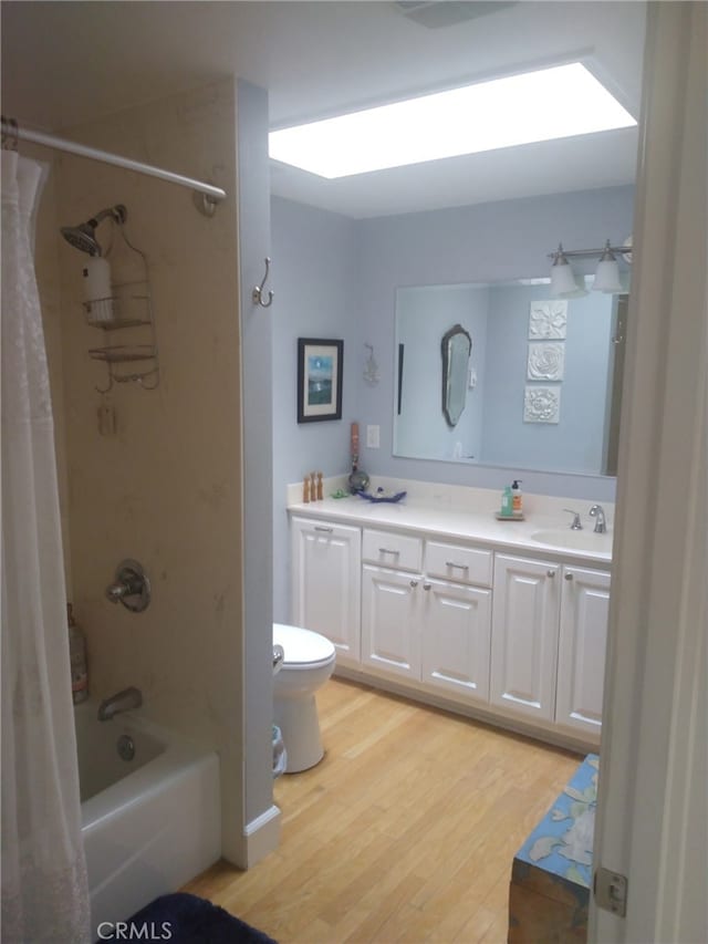 13141 Shawnee Ln Unit M-11 # 267-C, Seal Beach, CA 90740 - bathroom featuring shower / bath combination with curtain, vanity, and wood finished floors