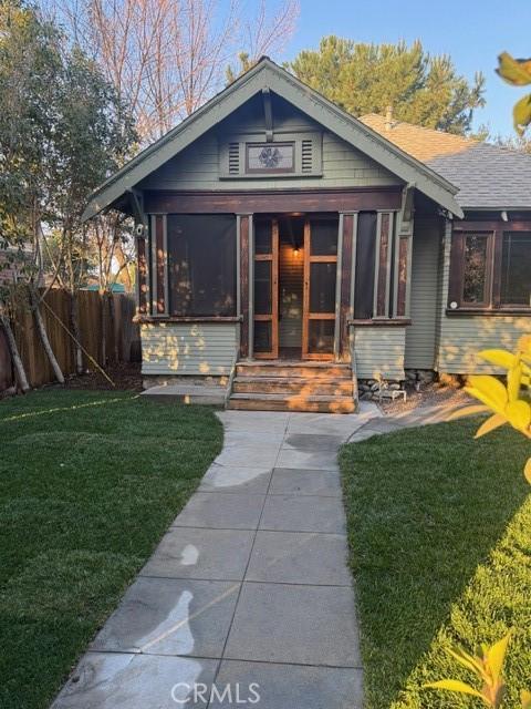 1355 N Gordon St, Pomona, CA 91768 - view of front facade featuring a sunroom