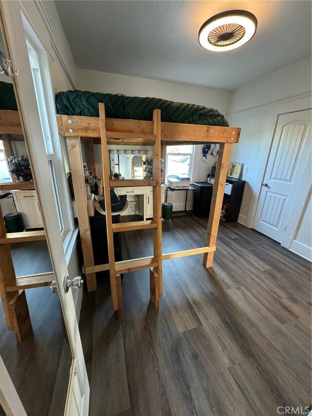 1355 N Gordon St, Pomona, CA 91768 - bedroom with dark wood-style flooring