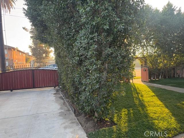 1355 N Gordon St, Pomona, CA 91768 - view of side of home featuring a gate