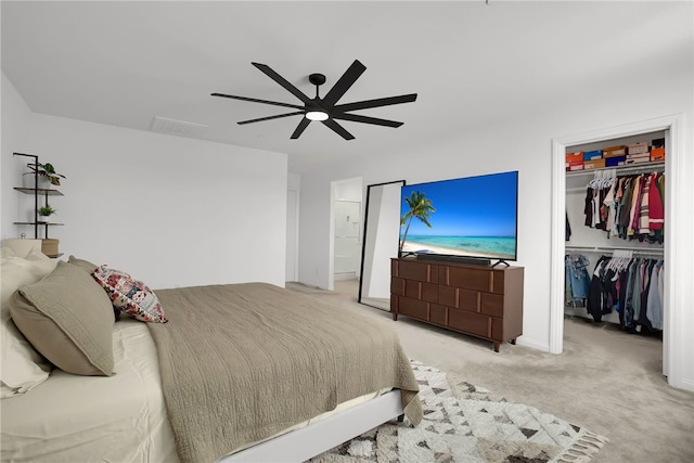 1768 Camellia Ln, Redlands, CA 92374 - bedroom featuring a walk in closet, a closet, light carpet, and ceiling fan