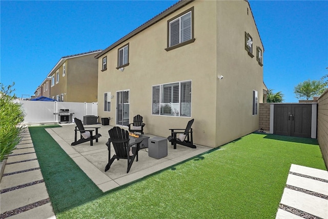 1768 Camellia Ln, Redlands, CA 92374 - back of property with a storage unit, a patio area, a fenced backyard, and stucco siding