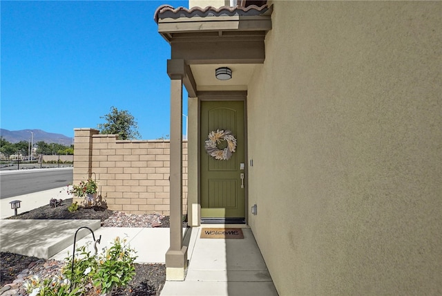1768 Camellia Ln, Redlands, CA 92374 - view of exterior entry featuring stucco siding and a mountain view