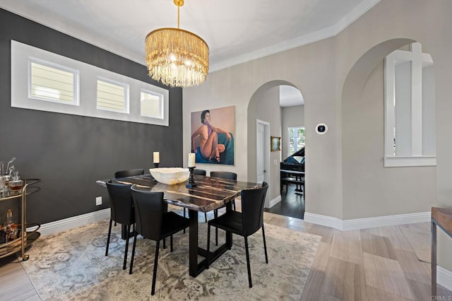 834 S Cedros, Solana Beach, CA 92075 - dining space with a chandelier, crown molding, wood finished floors, and arched walkways